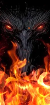If you're a fan of dark and edgy art, this live wallpaper will not disappoint! Featuring a demonic face engulfed in flames set against a black background, this design has a unique composite feature that resembles a bull's