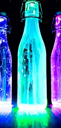 This stunning live wallpaper features three bottles made of glass, each containing different colored liquid