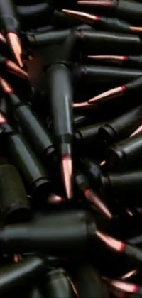 This live wallpaper features a pile of detailed bullet shells set against a dark and ominous background