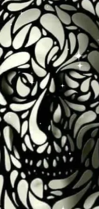 This phone live wallpaper showcases a black and white skull in generative art style overlaid with a vivid, hellish background