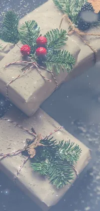 This phone live wallpaper showcases a delightful scene with three wrapped presents on a wooden table