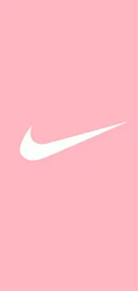 This phone live wallpaper features a clean white Nike logo set against a soft blush pink background with delightful visuals