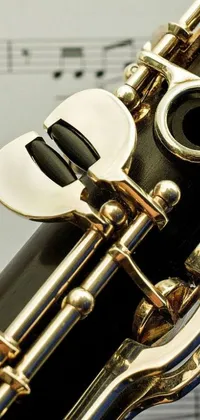 This stunning phone live wallpaper features a close-up view of a clarinet on a black lacquer finish