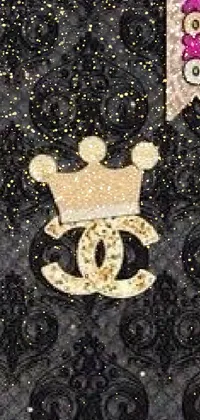 This luxurious phone live wallpaper features a close-up of a cell phone case adorned with a glittering crown embellished with rhinestones and pearls