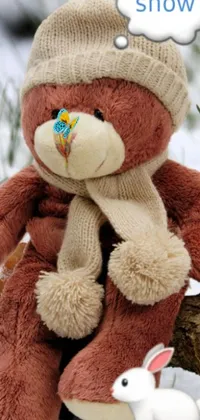 This phone live wallpaper features a cute, brown teddy bear sitting on a tree branch, surrounded by frozen flowers