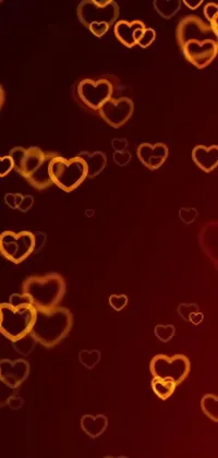 This heart-themed live wallpaper features glowing lights in shades of red and orange that pulsate gently to create a stunning visual effect