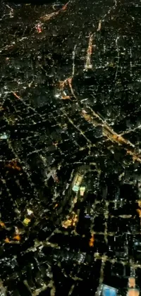 This phone live wallpaper showcases an aerial view of a city by night with vibrant colors and towering buildings