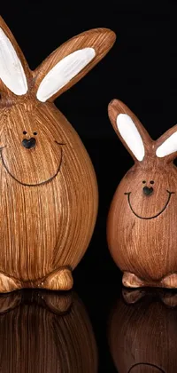This wooden rabbit phone live wallpaper showcases a delightful image of two intricately detailed rabbits seated next to each other