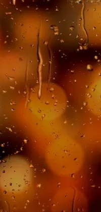 This phone live wallpaper features a mesmerizing closeup of a rain covered window