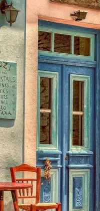This stunning live wallpaper for your phone features a wooden table sitting in front of a beautiful blue door