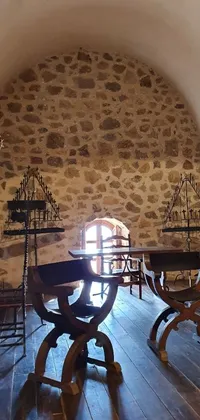 This stunning live wallpaper features a gothic baroque citadel room with wooden tables, chairs, and medieval weapon