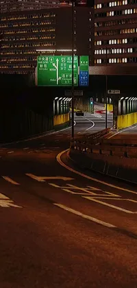 This phone live wallpaper depicts a bustling urban street at night with heavy traffic, magnificent skyscrapers and a towering overpass
