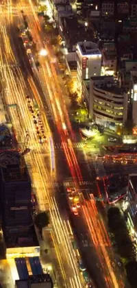 This live wallpaper features an aerial view of a dynamic and vibrant city at night, with tall skyscrapers and a traditional Japanese-inspired street
