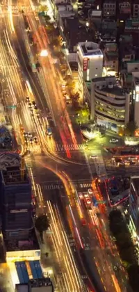 This phone live wallpaper boasts a captivating aerial view of a vibrant city at night