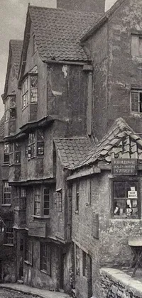 This Live Wallpaper features a vintage black and white photograph of a medieval town, complete with dilapidated houses, debris, and flickering street lights