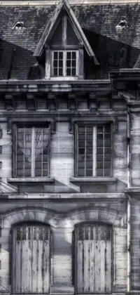 This phone live wallpaper showcases a stunning black and white photograph of an old building in photorealistic detail