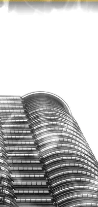 This live wallpaper features a black and white photo of a modernist skyscraper, high key detailed with vivid lines, reflecting Malaysian aesthetic