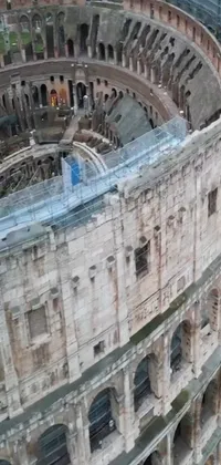 This phone live wallpaper showcases an aerial view of the inside of the Colosseum, an iconic symbol of Rome