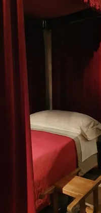 This phone live wallpaper showcases a bed with a red canopy in a serene room