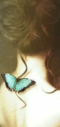 This stunning phone live wallpaper showcases a graceful butterfly perched on the back of a woman