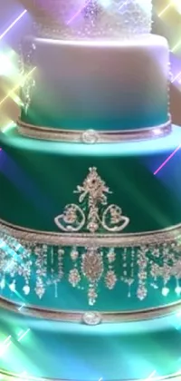 This stunning live wallpaper features a three-tiered cake in shades of teal with white diamond-shaped ornamentation and intricate symmetrical icing designs