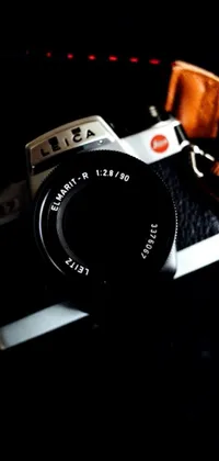This phone live wallpaper showcases a Leica SL 2 camera in realistic photography style