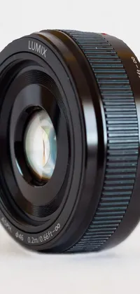 Looking for a unique and stunning live wallpaper for your phone? Check out this highly detailed close-up of a camera lens! With its photorealistic quality and miniature product photo look, this wallpaper is perfect for anyone who loves modern design and high sharpness photos