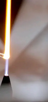 This live phone wallpaper features a metal object with a flame, designed to give a sci-fi and futuristic feel