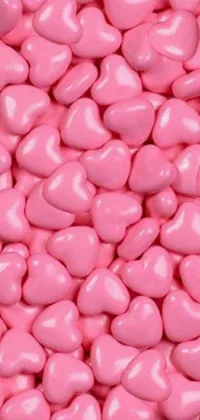 This charming phone live wallpaper features a pile of vibrant pink candy hearts, each with sweet sayings like "Be Mine" and "XOXO"