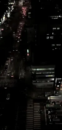 This live wallpaper for phones features an aerial night view of a city, displaying the modern metropolitan atmosphere with intricate skyline details and glowing building lights