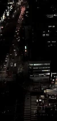This phone live wallpaper depicts a stunning aerial view of a bustling city at night