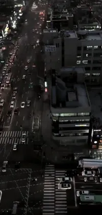 This live wallpaper showcases a stunning aerial view of a modern city at night