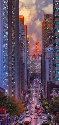 Get a glimpse of a bustling street filled with traffic beside imposing buildings in this majestic phone live wallpaper