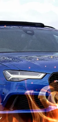 Get a stunning live wallpaper for your phone featuring a blue Audi model parked on the side of the road