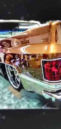 This phone live wallpaper features a close up of a car on display at a car show