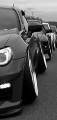 Experience a stunning phone live wallpaper featuring a black and white photo of a line of cars