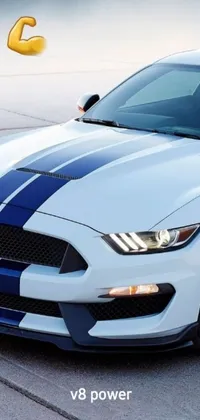 Looking for a dynamic new live wallpaper for your phone? Introducing the latest trend-setting design: a white Ford Mustang parked in a parking lot