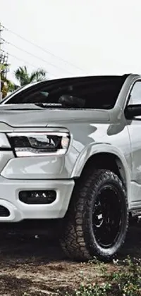 This phone live wallpaper depicts a stunning white Ram truck parked beside a railroad track