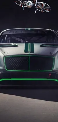 Elevate your mobile device's style with a close-up view of a stunning, green-light adorned race car from Bentley