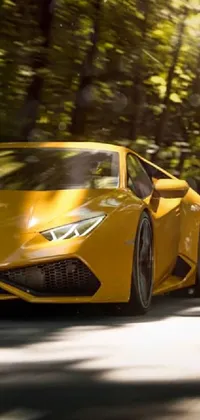 This live wallpaper features a captivating image of a yellow sports car driving down a winding road