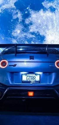 This live phone wallpaper features an awe-inspiring blue sports car photographed against a beautiful moonlit night by An Gyeon in the year 2020
