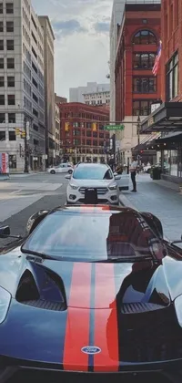 Looking for a high-quality live wallpaper for your phone? Check out this stunning black and red sports car parked on a city street in Cleveland! The detailed design of the car, combined with the energetic city background, makes this wallpaper a great choice for car enthusiasts or anyone who wants a cool new phone wallpaper