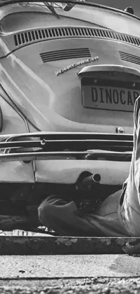 Get this incredible live wallpaper for your phone featuring a vintage 1970s car captured in a black and white photorealistic image