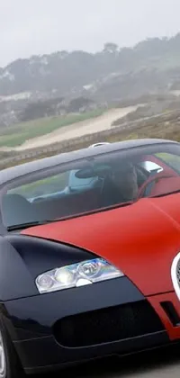This live wallpaper depicts a stunning Bugatti Veyron in red and black driving down a picturesque road in the Bay Area