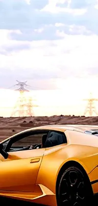 This live phone wallpaper shows a yellow sports car parked on the side of a road in the desert