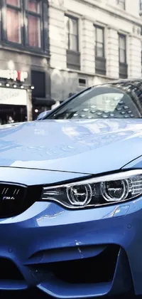 This stunning live wallpaper for your phone features a photo-realistic image of a blue BMW car parked on a bustling Manhattan street