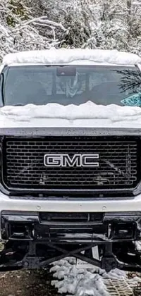 Looking for a unique and captivating live wallpaper for your phone? Look no further than this stunning image of a white truck parked in the snow