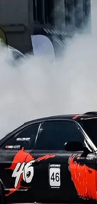 Looking for a thrilling live phone wallpaper? Look no further than this dynamic image featuring a car drifting around a corner amidst billowing clouds of smoke