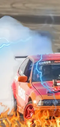 This mobile wallpaper showcases a car emitting plumes of smoke while racing on a track