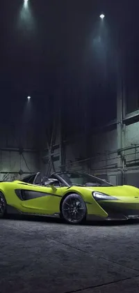 This stunning phone live wallpaper showcases a yellow McLaren sports car parked in a green-themed garage